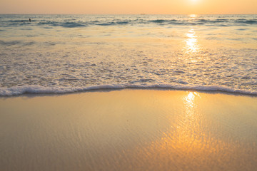 Fototapeta na wymiar Golden sunrise sunset over the sea ocean waves