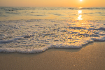 Golden sunrise sunset over the sea ocean waves