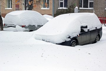 Car under the snow after a heavy snowfall