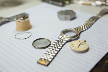 Detail of watch machinery on the table.