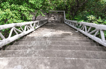 Concrete stairs on the hill leading down.