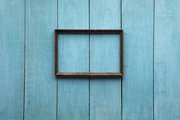 Naklejka na ściany i meble wooden photo frame on wooden wall