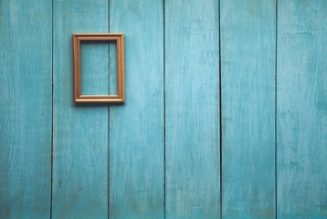 Fototapeta na wymiar wooden photo frame on wooden wall