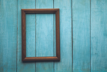 Naklejka na ściany i meble wooden photo frame on wooden wall