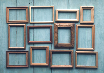 old frames on wooden wall