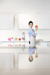 Fototapeta na wymiar Young woman in the kitchen