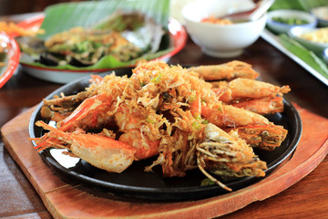 Fried shrimp with peppers, garlic and chilli recipe on hot iron