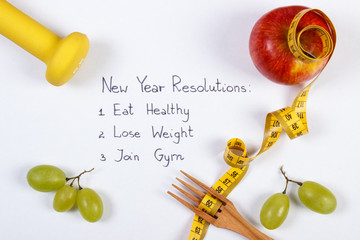 Naklejka na ściany i meble New year resolutions, fruits, dumbbells and centimeter, healthy food and lifestyle