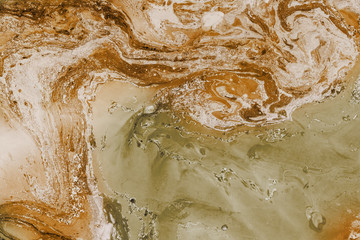 Orange marbling texture. Creative background with abstract oil painted waves handmade surface. Liquid paint.