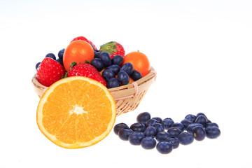 Fototapeta na wymiar Blueberry kiwi strawberries and oranges