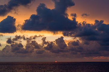 Naklejka na ściany i meble Sunset on the beach with beautiful cloudy sky