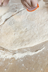 Close up of a father and his son preparing a cake in the kitchen