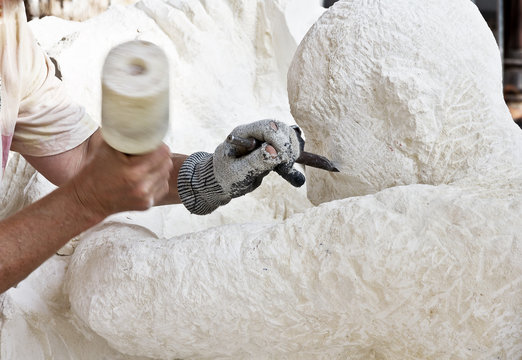  Sculptor makes a sculpture of stone