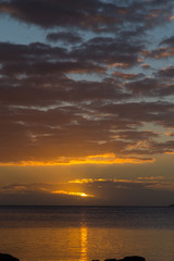 Naklejka na ściany i meble Golden sunset over ocean . Sky Fiji