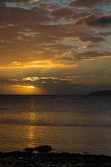 Golden sunset over  ocean . Sky Fiji