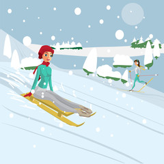 Pretty young woman riding a snow sled riding a snow sled from a