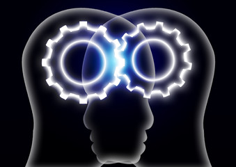 チームワーク　噛みあう二つの歯車と人物のシルエット