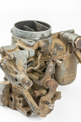 Old dirty used carburetor isolated over white background