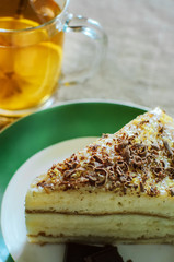a piece of homemade biscuit cakewith chocolate sprinkles closeup