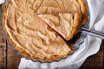 Homemade cowberry tart with merengue.