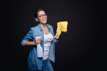 Joyful young woman having fun in the studio