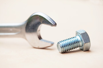 Threaded bolt with fixed spanner