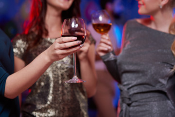 Close up of hand holding drinking glass