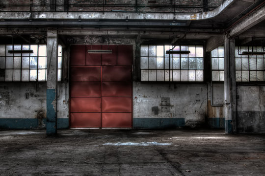 The red door of a garage for mine vehicles