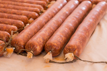 Pile of domestic red sausages on the table