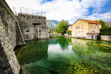 Fototapeta na wymiar Mediterranean landscape. Medieval city walls, fortifications and river in Kotor, Montenegro.