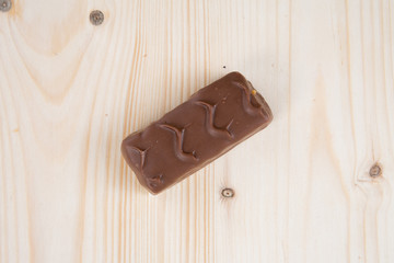 chocolate industrial bar in wood background