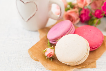 Morning coffee with flowers and macaroons. Mather's day  Valentine'  concept.