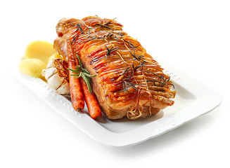 roasted pork and vegetables on white plate