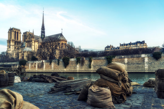 Fototapeta Docks of Notre Dame Cathedral in Paris with old barrels, France