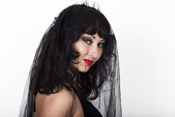 black widow in a veil, mysterious sad woman wearing lace