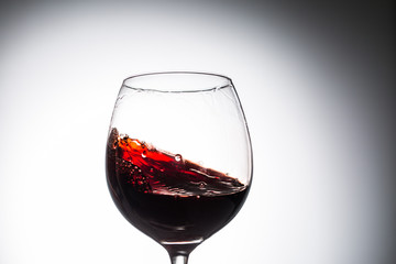 Stream of wine being pouring into a glass.