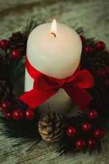 Burning candles in a Christmas wreath