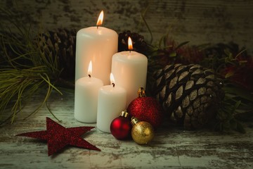 Burning candles in a Christmas wreath