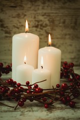Burning candles in a Christmas wreath