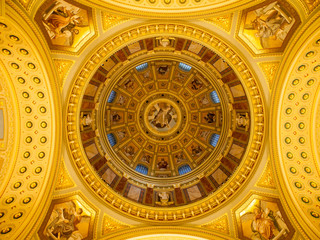 Fototapeta na wymiar Indoor view of colorful picturesque dome ceiling in Saint Stephen's Basilica, Budapest, Hungary, Europe. UNESCO World Heritage Site.