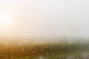 Obraz premium Wet glass with drops, background