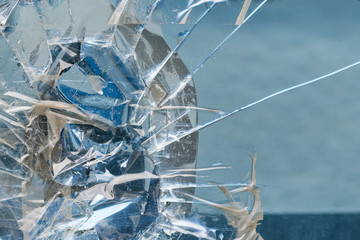 Broken blue glass sealed with tape, background