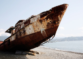 Sea shore, abandoned ship. Abkhazia, Sukhum