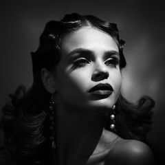 Beauty portrait of woman in retro style. Add noise and filters.