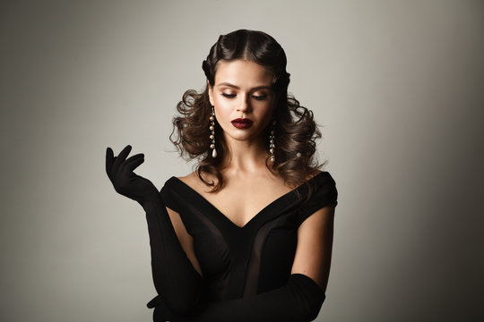 Beauty studio portrait of woman in retro style. Perfect makeup a
