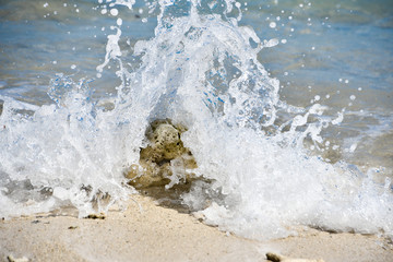 Wave splashing on sandy beach