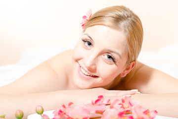 Obraz na płótnie Canvas Portrait pretty woman during spa massage procedures in salon