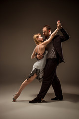 The man and the woman dancing argentinian tango - obrazy, fototapety, plakaty