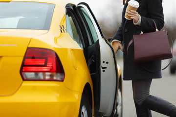 Fototapeta premium Girl with bag near cab