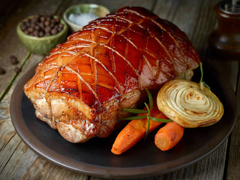 roasted pork on dark plate